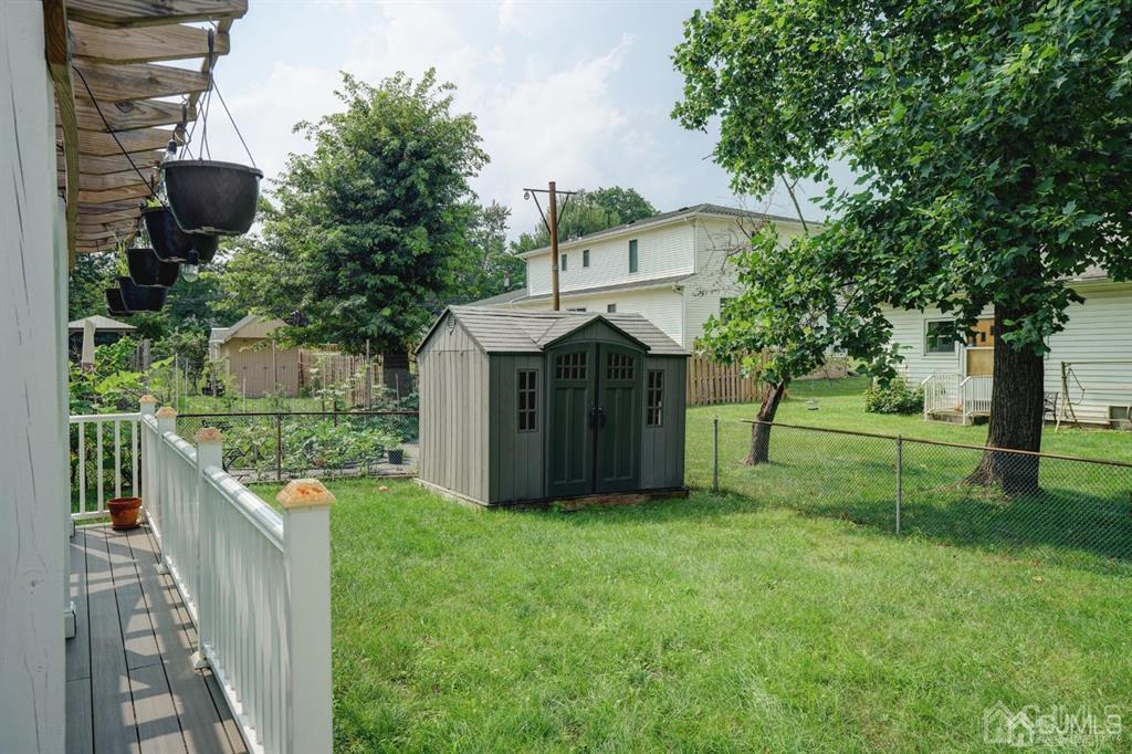 7 Calvert Avenue East Edison, NJ 08820 - Photo 8 of 47 a view of a house with backyard and a tree
