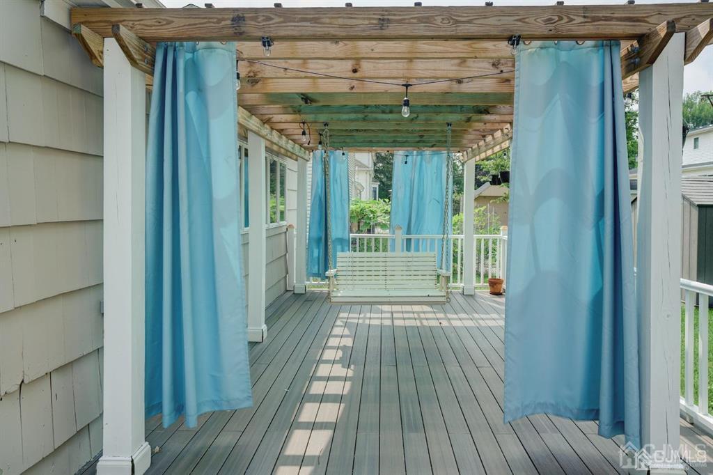 7 Calvert Avenue East Edison, NJ 08820 - Photo 9 of 47 a view of a porch with wooden floor and stairs