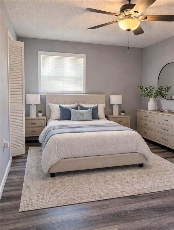 123 Mayview Lane Sandersville, GA 31082 - Photo 12 of 28 a bedroom with a large bed and a chandelier