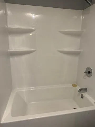 a bathroom with a sink a mirror and a toilet