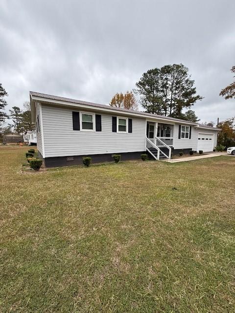 123 Mayview Lane Sandersville, GA 31082 - Photo 3 of 20 a front view of a house with a yard