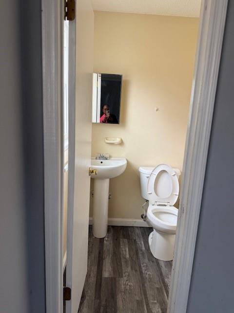 123 Mayview Lane Sandersville, GA 31082 - Photo 10 of 20 a white toilet sitting next to a bathroom sink