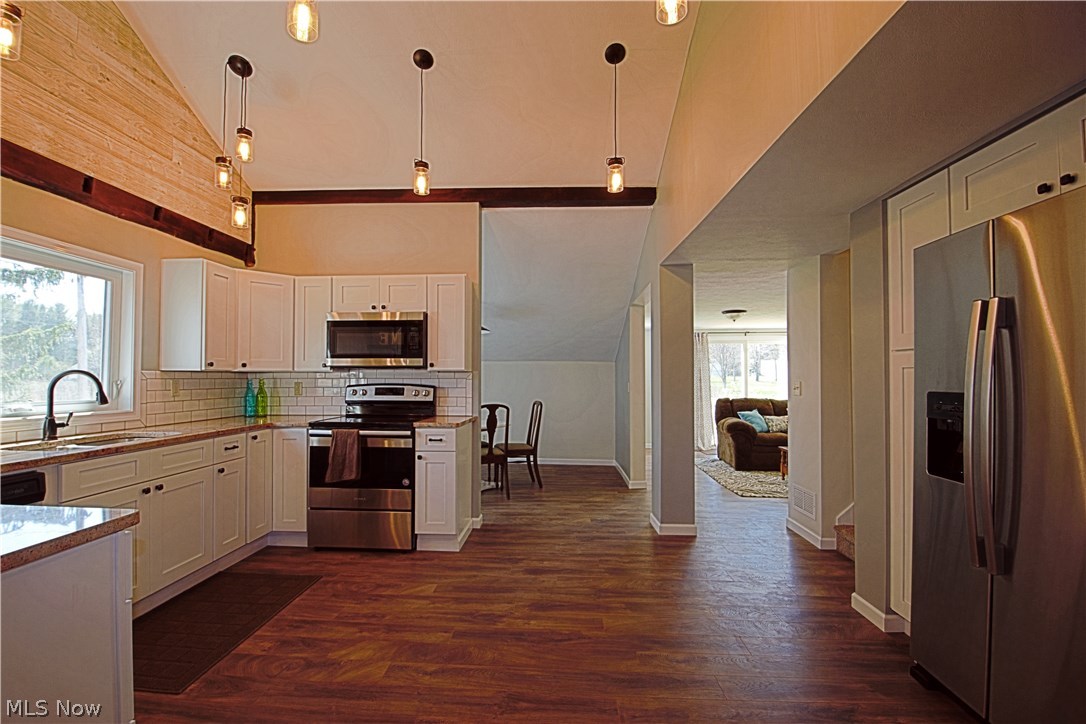 7670 Dewey Road Thompson, OH 44086 - Photo 13 of 34 Off the kitchen is the dinning room & living room.