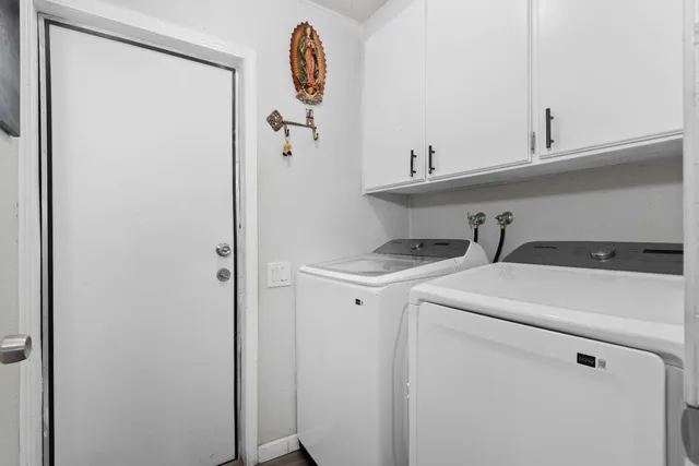 a utility room with dryer and washer