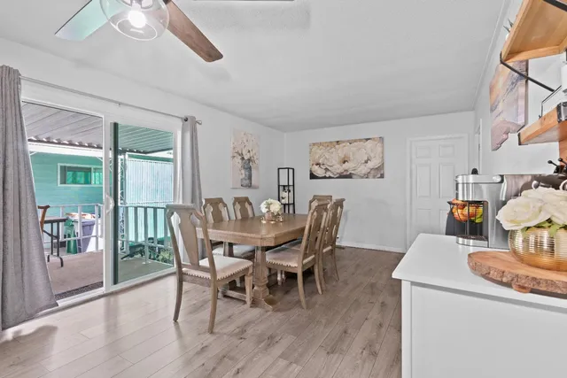 a dining room with furniture and window