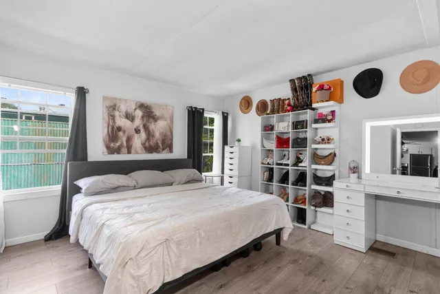 a bedroom with a bed and a book shelf