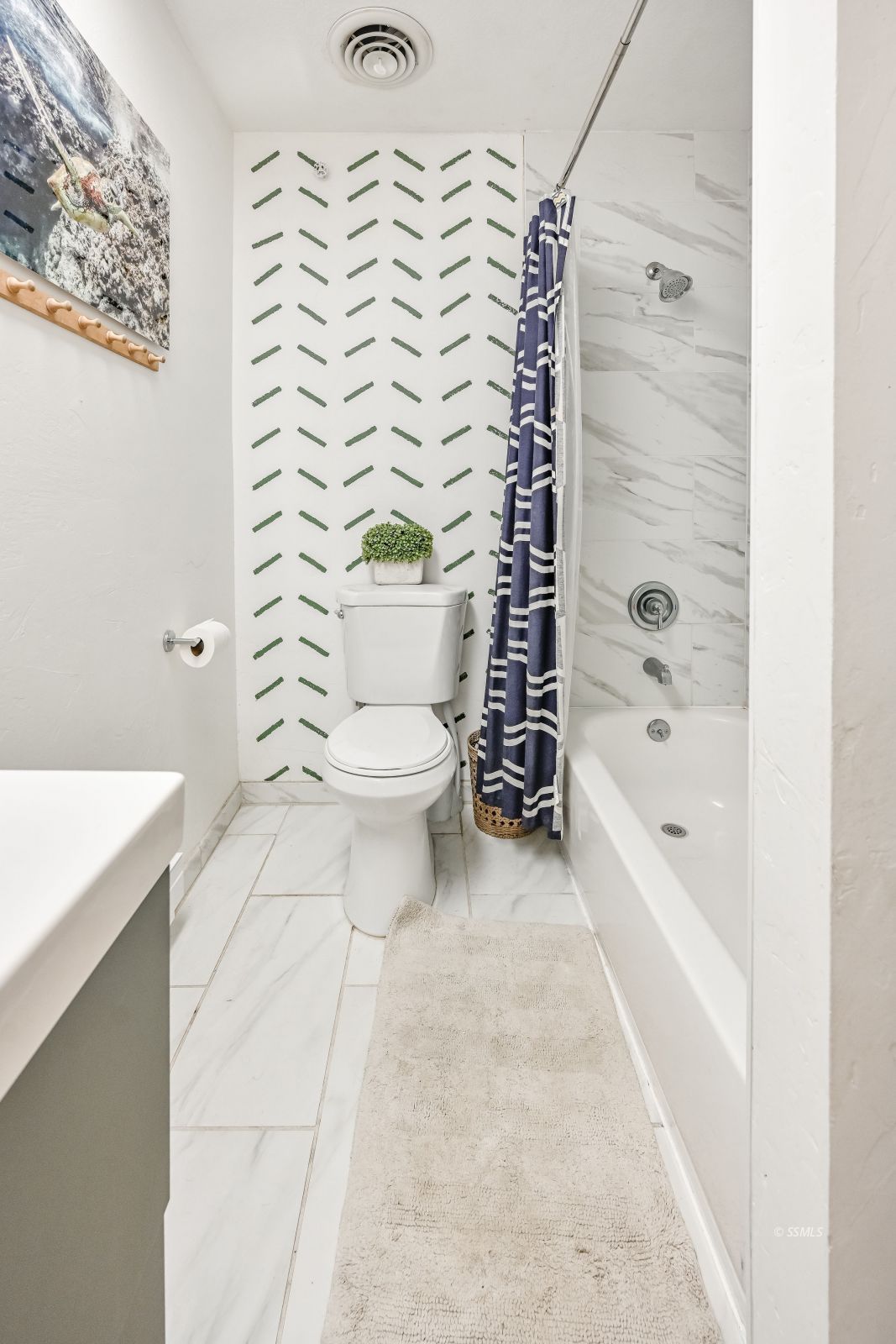 1407 North Indian Wells Street Ridgecrest, CA 93555 - Photo 28 of 50 a bathroom with a toilet and shower