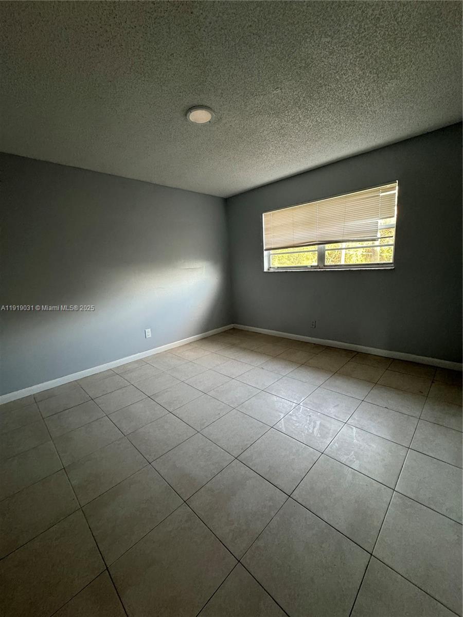 6840 Pembroke Road, Unit 202 Pembroke Pines, FL 33023 - Photo 4 of 7 a view of empty room with window