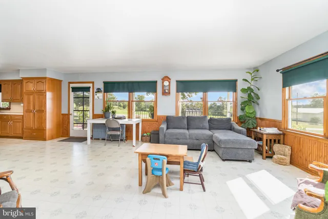 a kitchen with stainless steel appliances granite countertop a sink a stove and a wooden floors