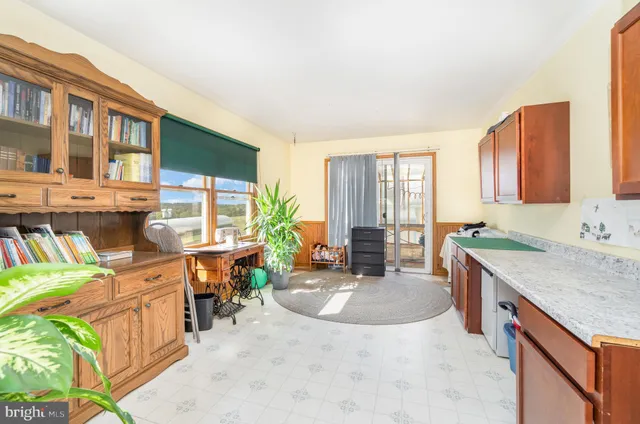 a kitchen with stainless steel appliances granite countertop sink stove and refrigerator