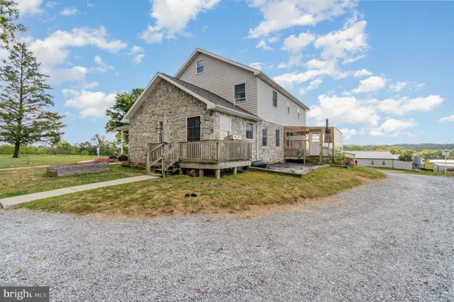 a view of yard with swimming pool and trees