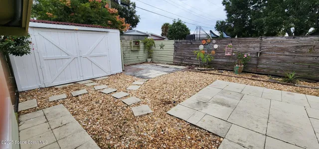 a view of a backyard of the house