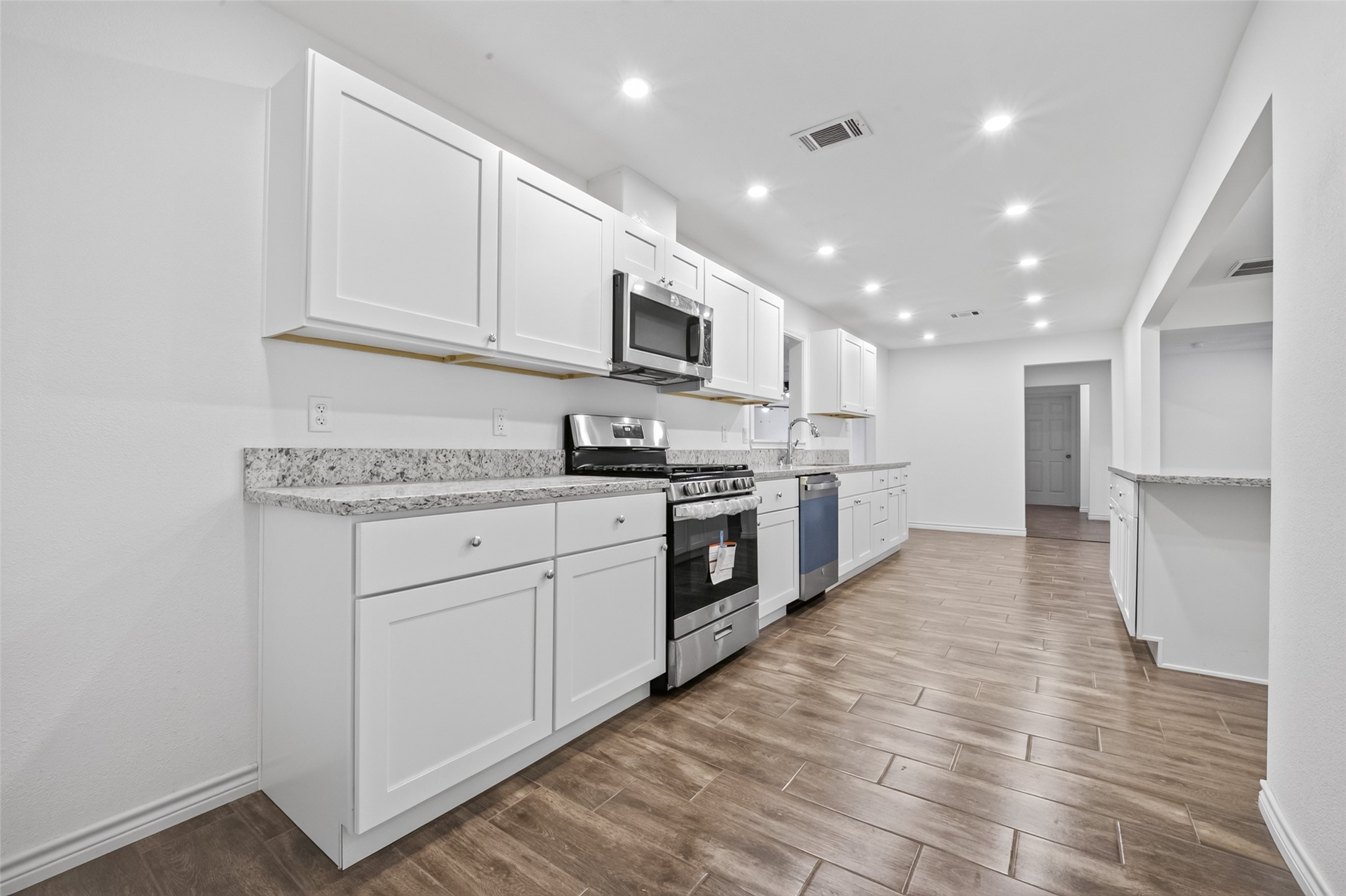 3530 Rosedale Street Houston, TX 77004 - Photo 13 of 50 Spacious kitchen with modern appliances and an open layout.