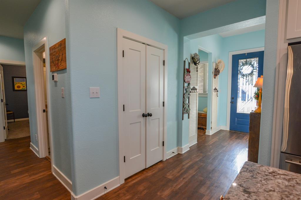 601 Mathew Street Grandview, TX 76050 - Photo 33 of 40 a view of a hallway with wooden floor and closet area