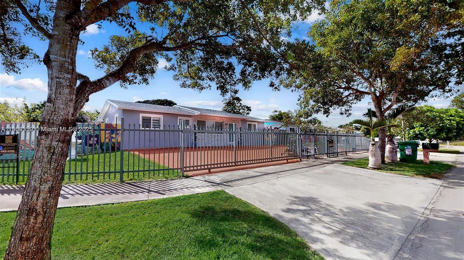 15704 Southwest 302nd Terrace Homestead, FL 33033 - Photo 1 of 26 a view of a park with a large trees