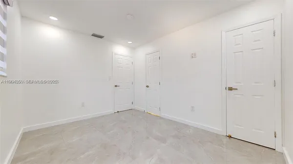 a bathroom with a granite countertop sink mirror and vanity