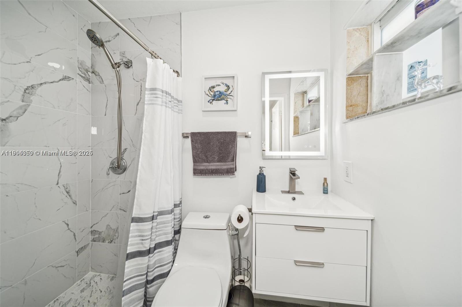 15704 Southwest 302nd Terrace Homestead, FL 33033 - Photo 15 of 26 a bathroom with a sink toilet vanity and shower
