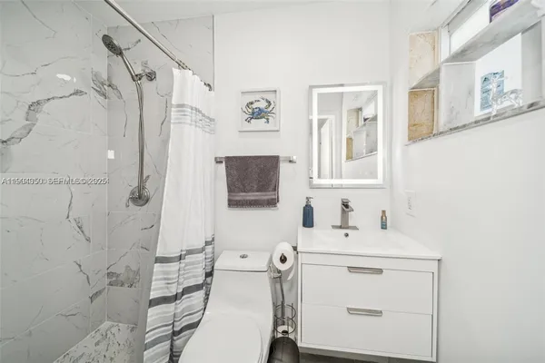 a view of a hallway with washer and dryer