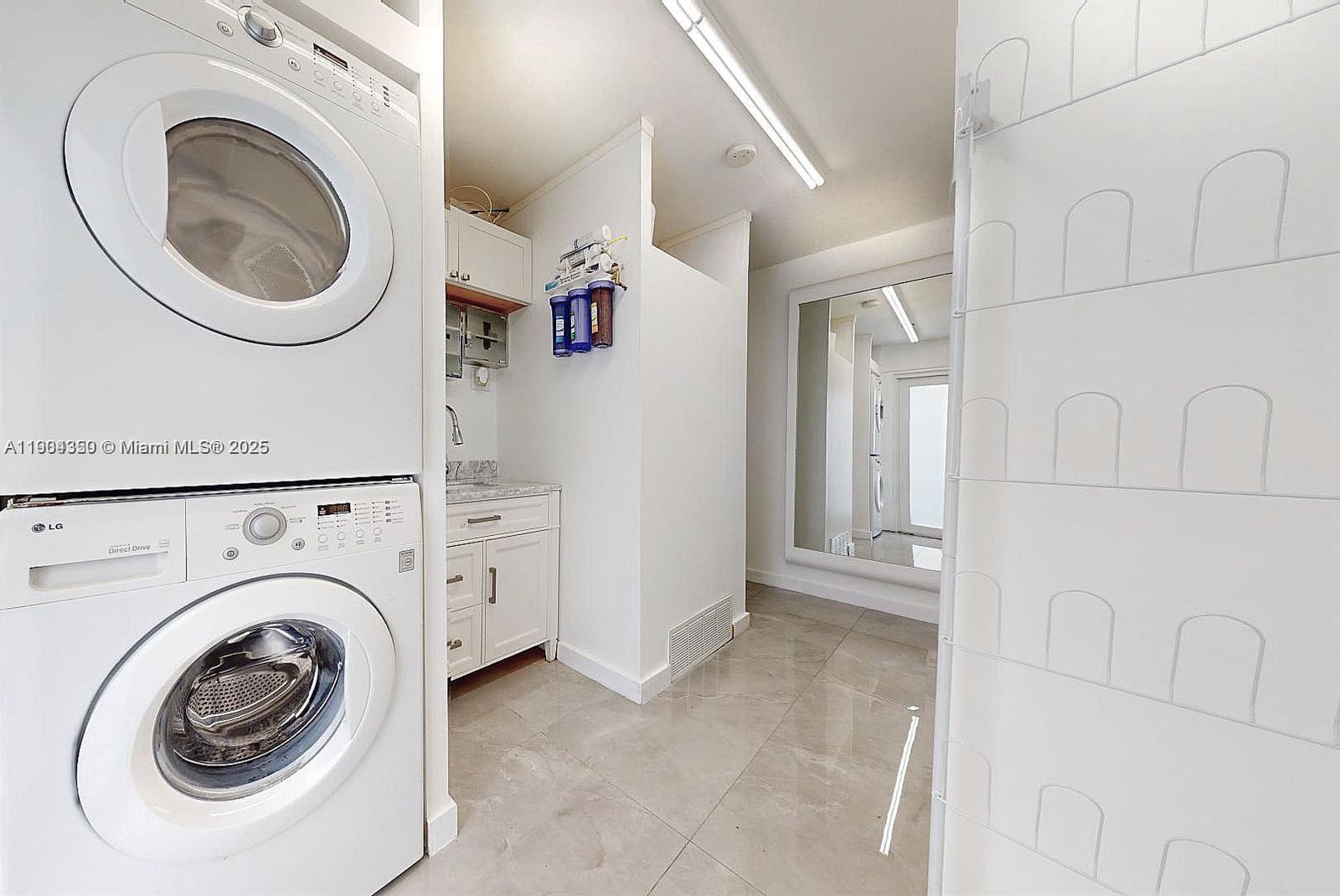 15704 Southwest 302nd Terrace Homestead, FL 33033 - Photo 16 of 26 a view of a hallway with washer and dryer