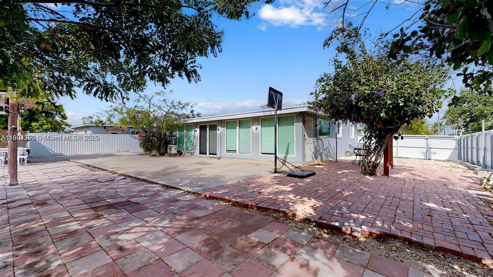 15704 Southwest 302nd Terrace Homestead, FL 33033 - Photo 22 of 26 a view of a backyard with a tree