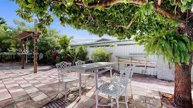 a outdoor living space with furniture and a fireplace