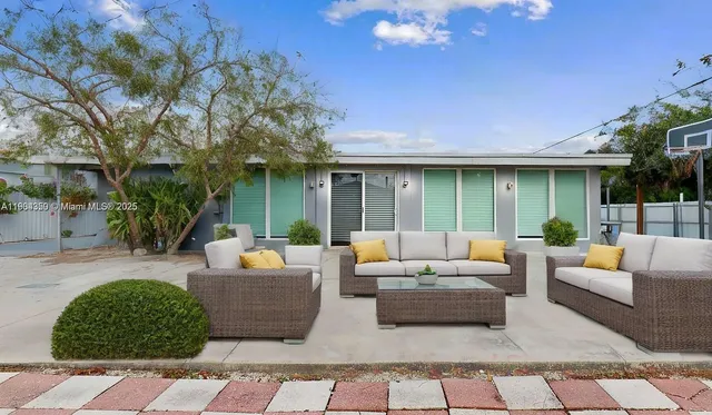 a view of backyard of a house
