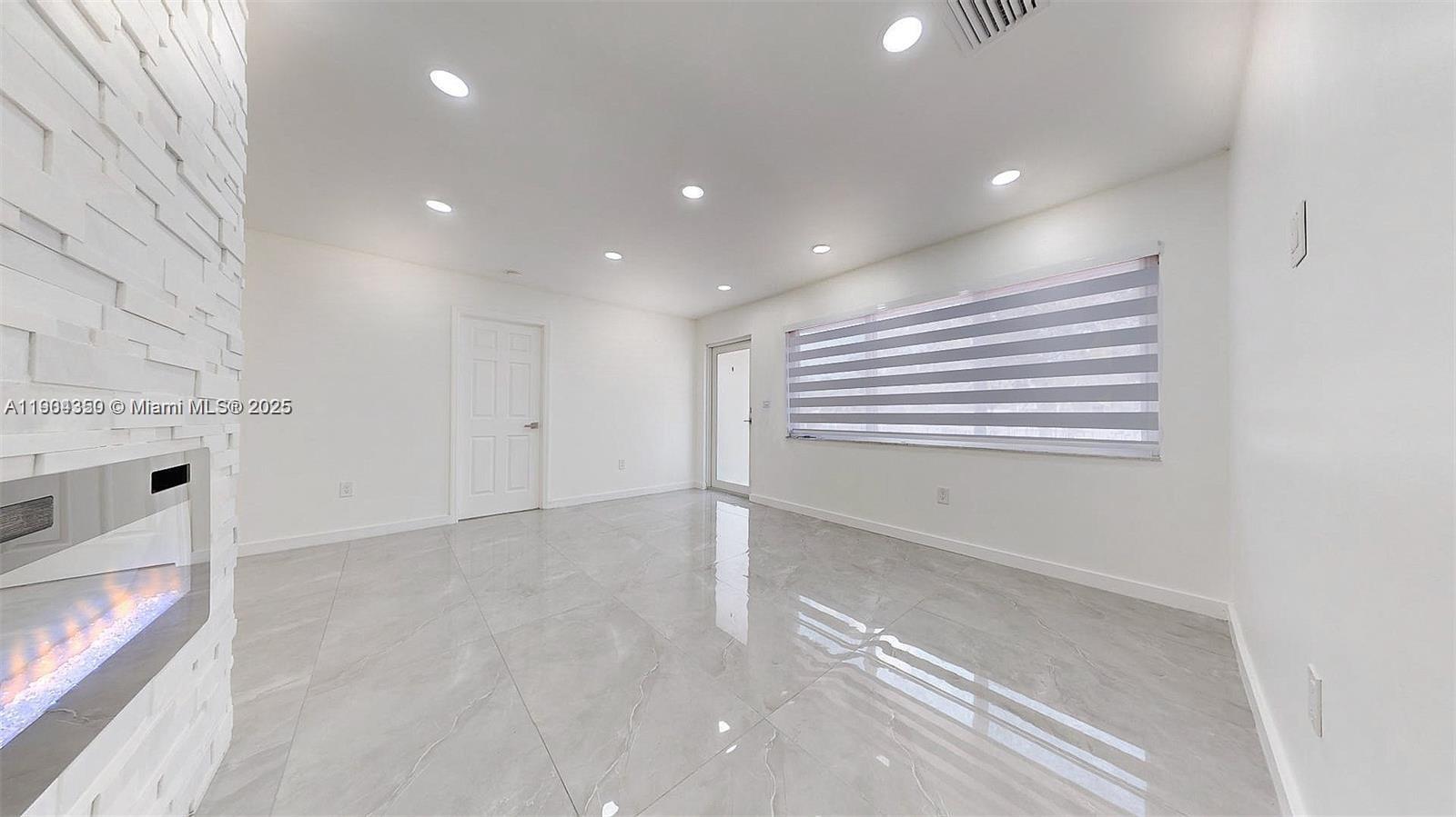 15704 Southwest 302nd Terrace Homestead, FL 33033 - Photo 5 of 26 a view of an empty room with a window