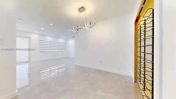 a bedroom with a bed and potted plant