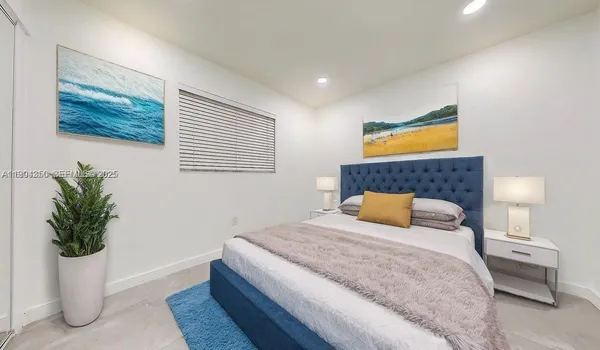 a bathroom with a toilet sink vanity and mirror