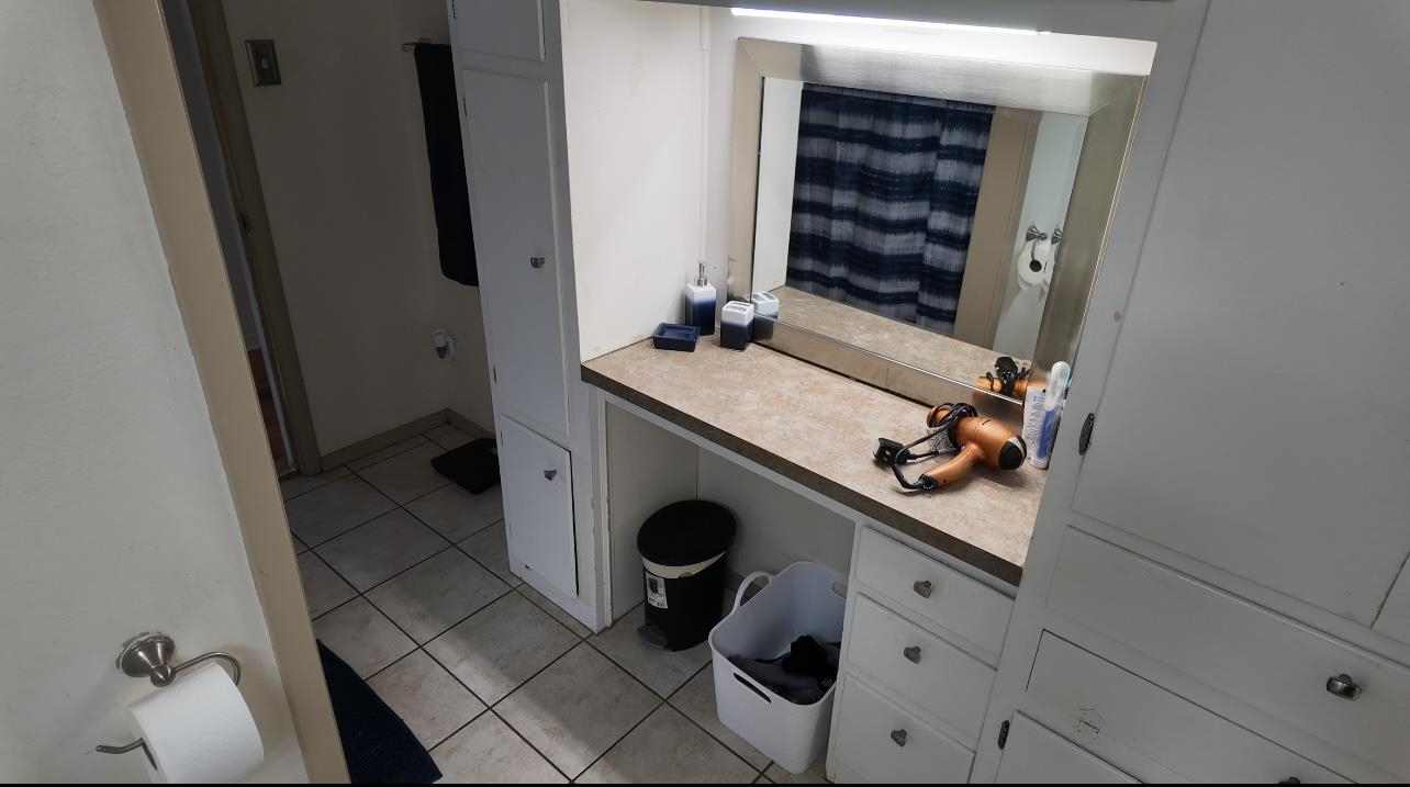 2709 Rice Avenue San Angelo, TX 76904 - Photo 12 of 28 a bathroom with a sink and a mirror