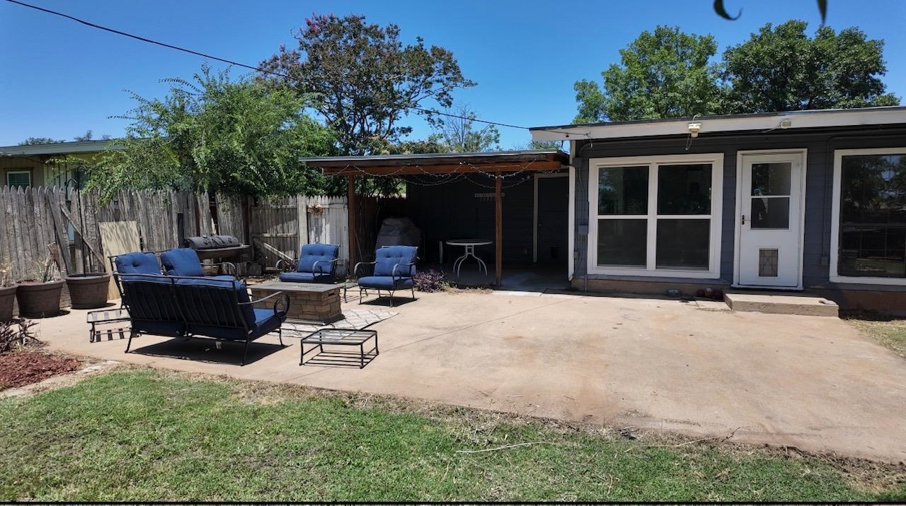 2709 Rice Avenue San Angelo, TX 76904 - Photo 20 of 28 a view of a backyard with a sitting area and furniture
