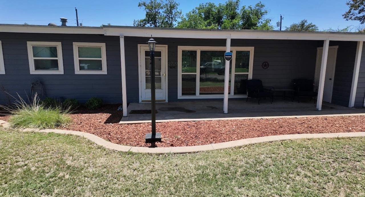 2709 Rice Avenue San Angelo, TX 76904 - Photo 2 of 28 a view of house with yard