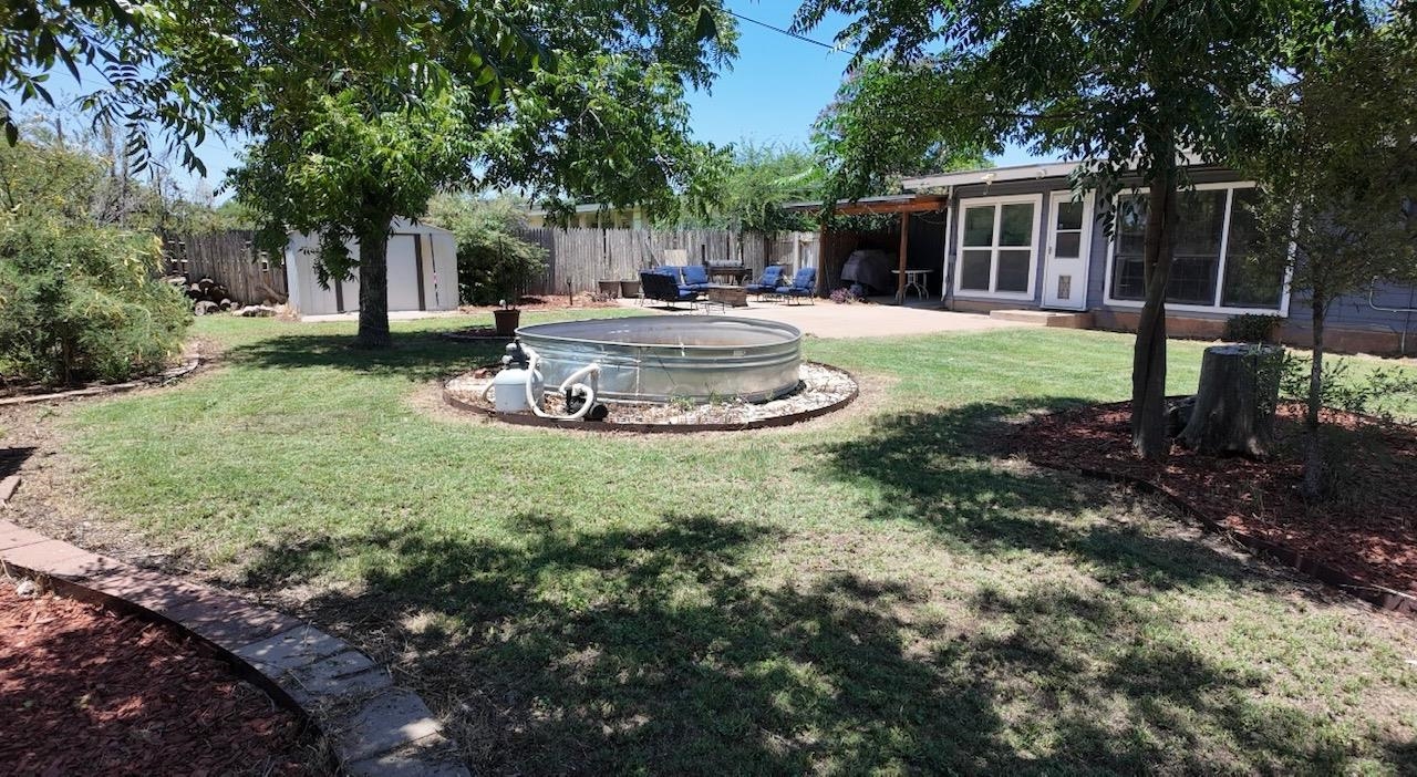 2709 Rice Avenue San Angelo, TX 76904 - Photo 25 of 28 a view of a house with backyard and trees
