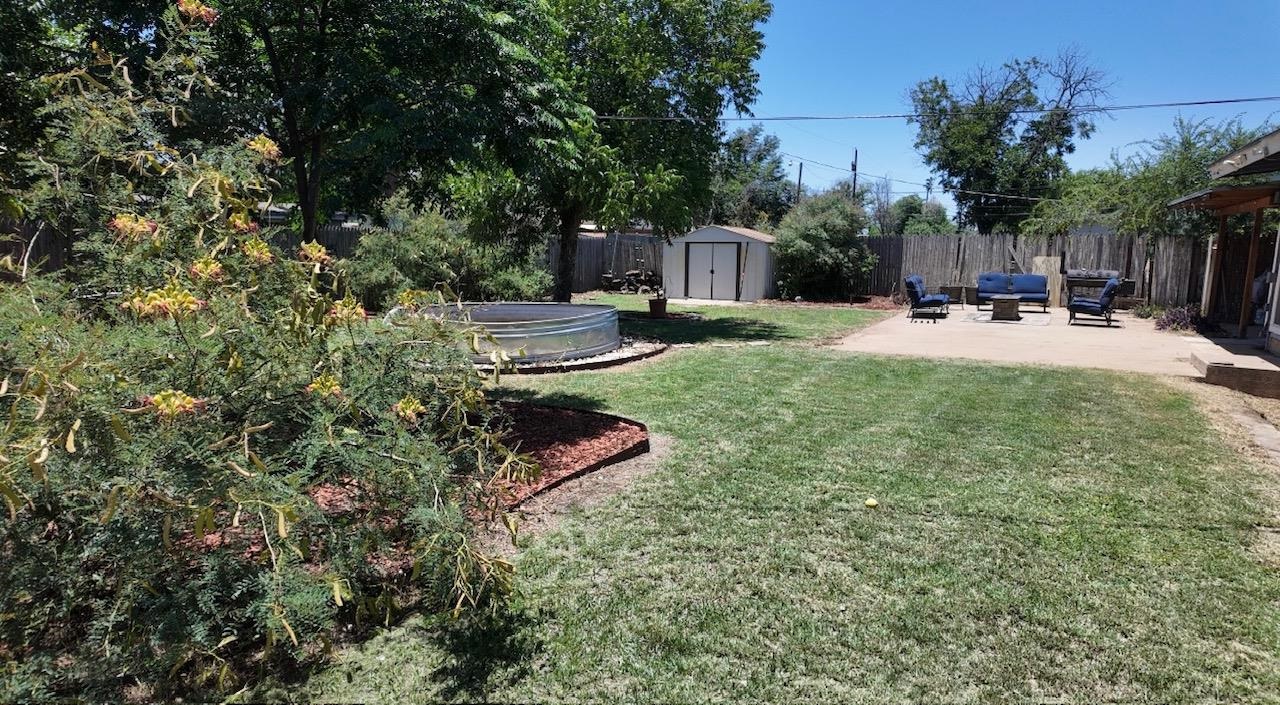 2709 Rice Avenue San Angelo, TX 76904 - Photo 26 of 28 a view of backyard with swimming pool and sitting area