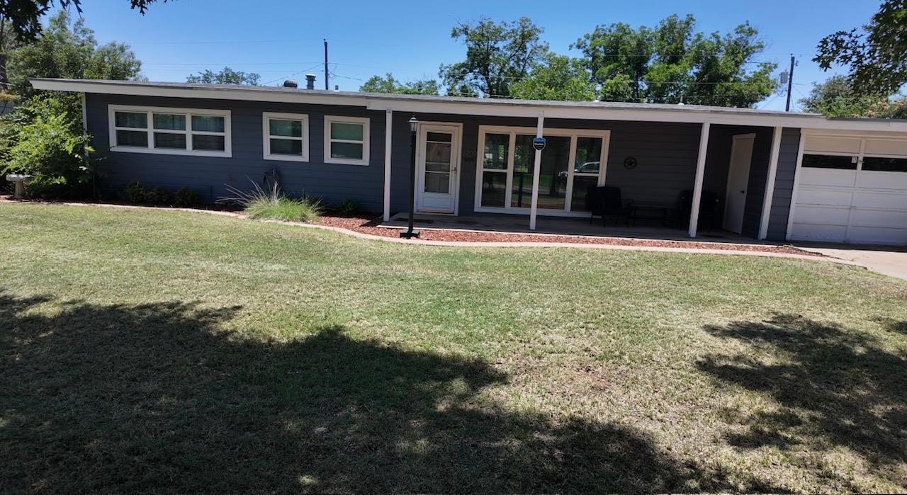 2709 Rice Avenue San Angelo, TX 76904 - Photo 28 of 28 a view of a house with backyard and porch