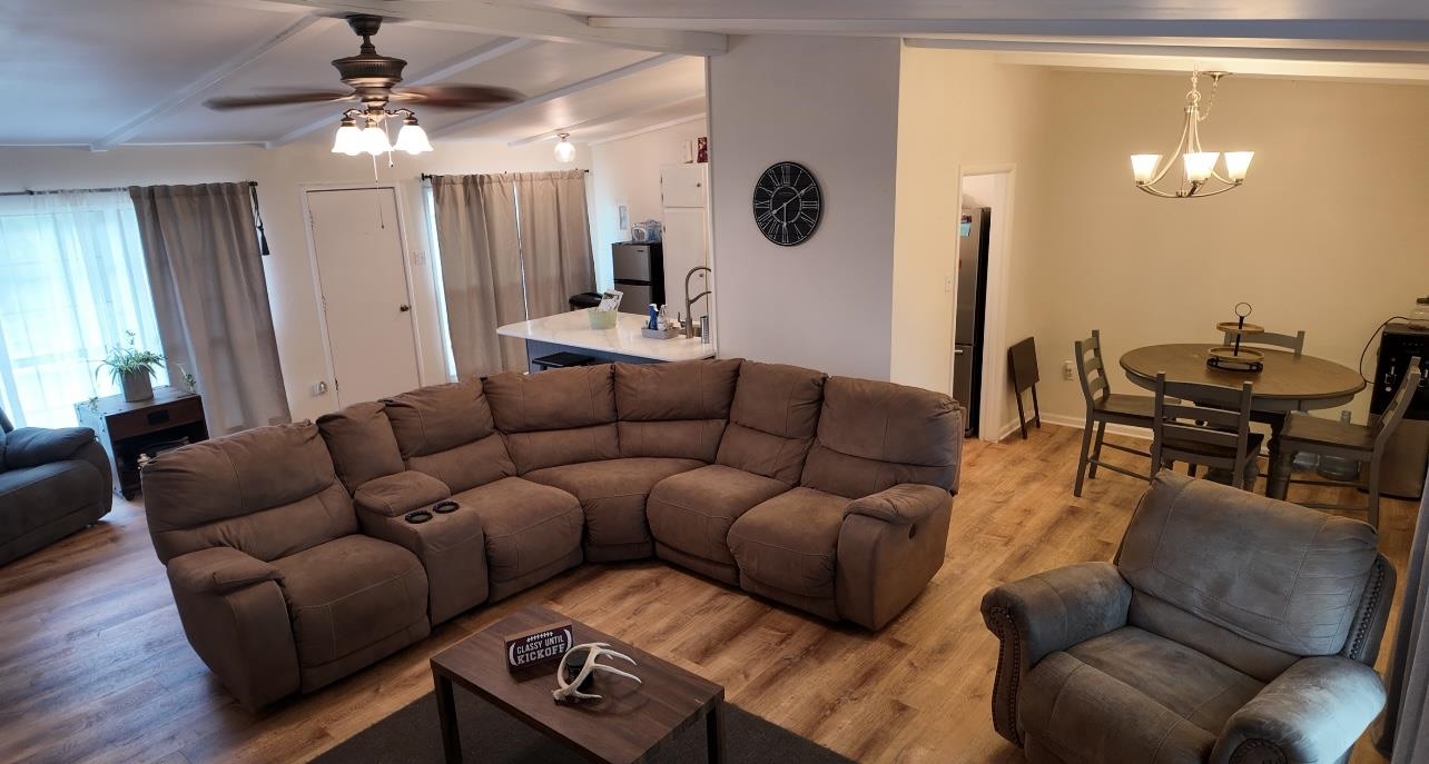 2709 Rice Avenue San Angelo, TX 76904 - Photo 4 of 28 a living room with furniture a lamp and a large mirror