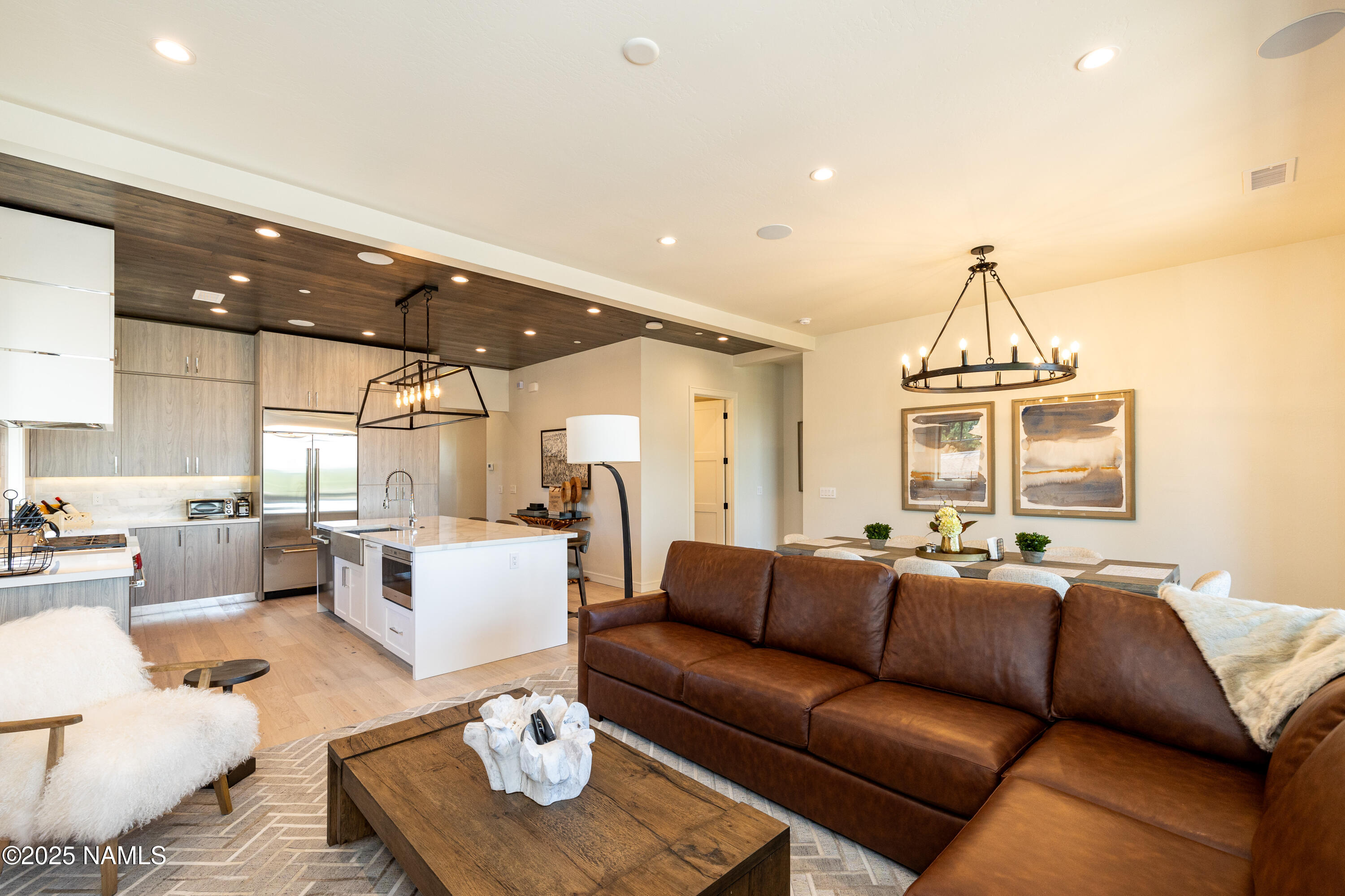 3001 South Tourmaline Drive, Unit 28 Flagstaff, AZ 86005 - Photo 16 of 41 a living room with furniture and a chandelier