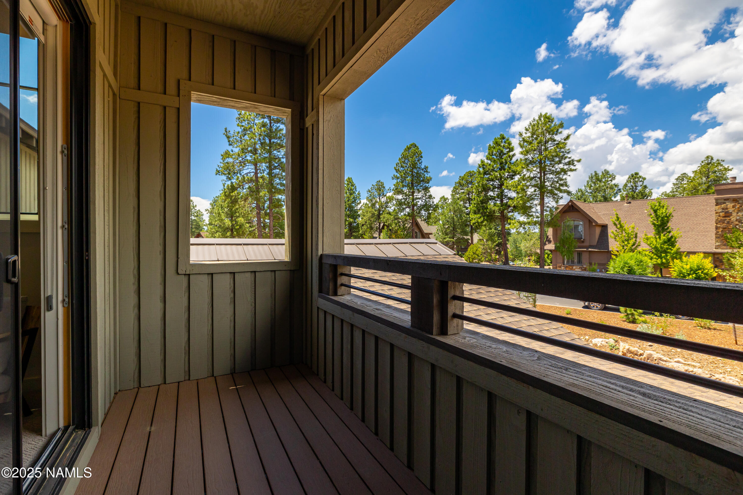 3001 South Tourmaline Drive, Unit 28 Flagstaff, AZ 86005 - Photo 25 of 41 a view of a balcony with wooden floor