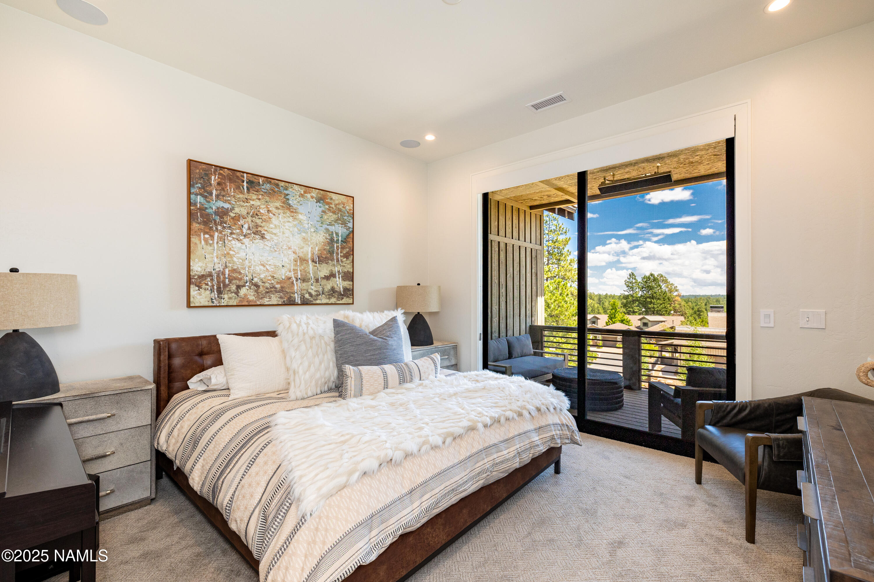 3001 South Tourmaline Drive, Unit 28 Flagstaff, AZ 86005 - Photo 29 of 41 a bedroom with a large bed and a large window