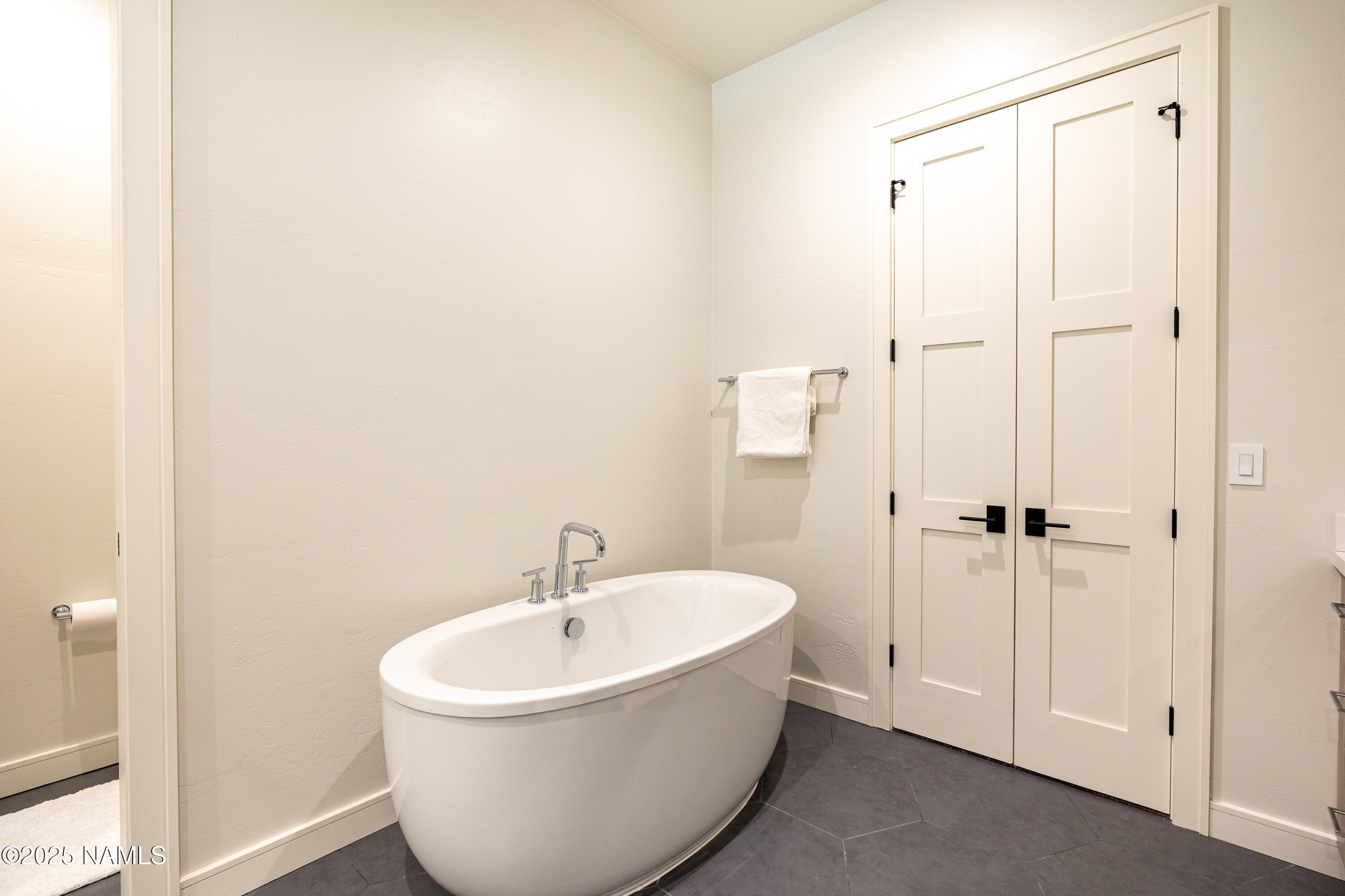3001 South Tourmaline Drive, Unit 28 Flagstaff, AZ 86005 - Photo 35 of 41 a white bath tub sitting next to a white sink