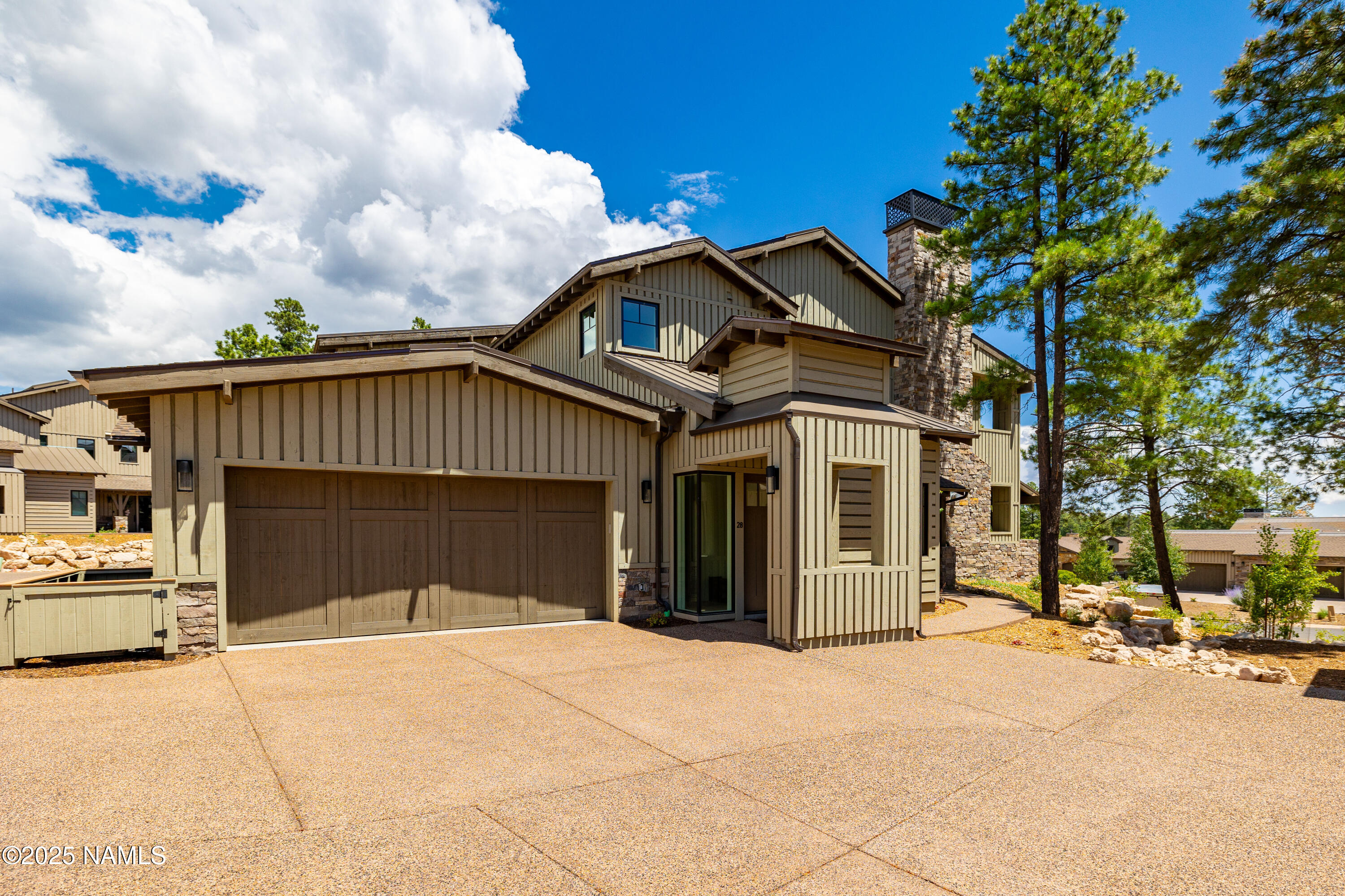3001 South Tourmaline Drive, Unit 28 Flagstaff, AZ 86005 - Photo 40 of 41 a front view of a house with a yard