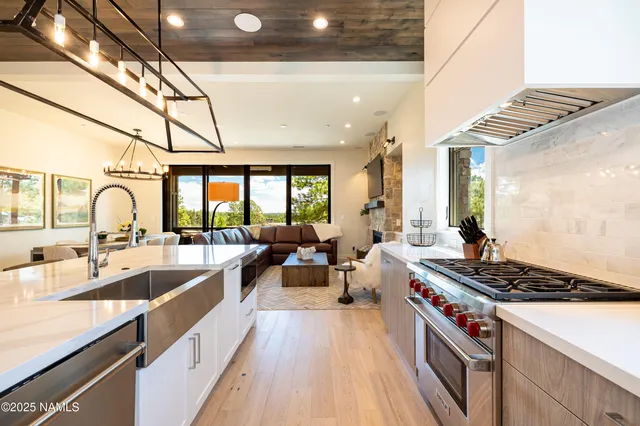 a living room with fireplace furniture and a flat screen tv