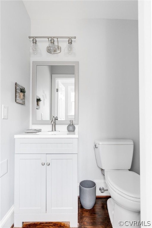 3180 East Brigstock Road Midlothian, VA 23113 - Photo 29 of 50 a bathroom with a toilet a sink and mirror