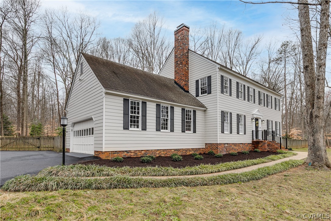3180 East Brigstock Road Midlothian, VA 23113 - Photo 3 of 50 a front view of a house with a yard