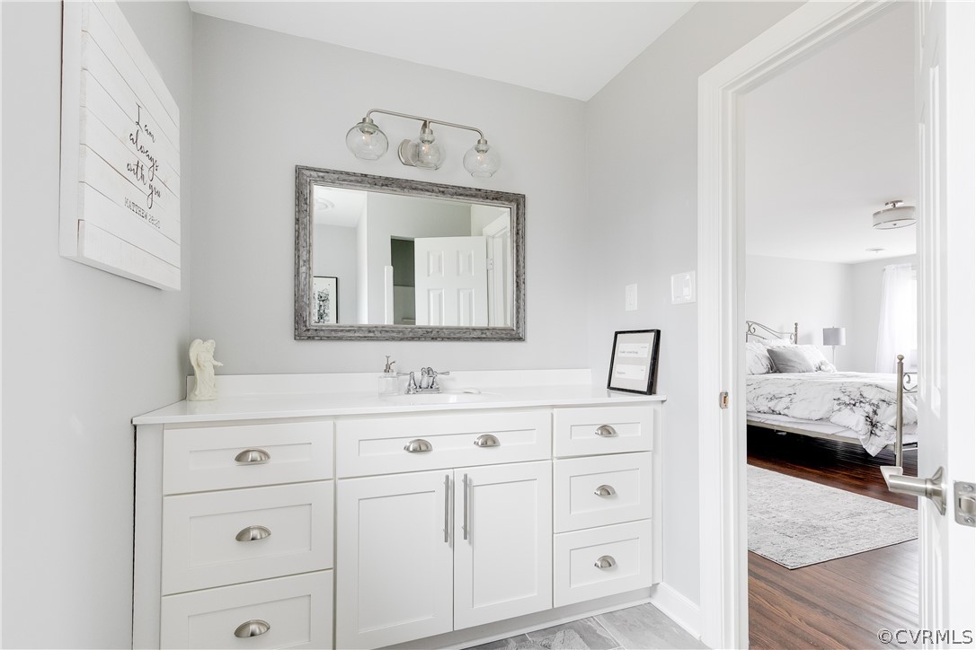 3180 East Brigstock Road Midlothian, VA 23113 - Photo 35 of 50 a en suite bathroom with double sink and a mirror