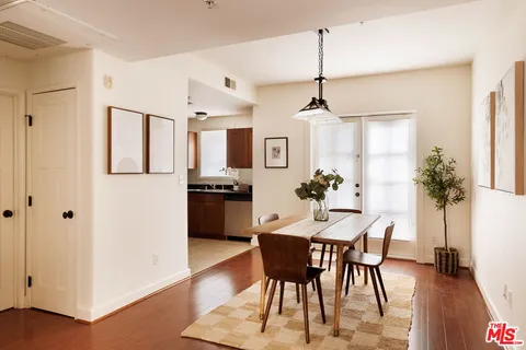 a view of a dining room with furniture window and wooden floor