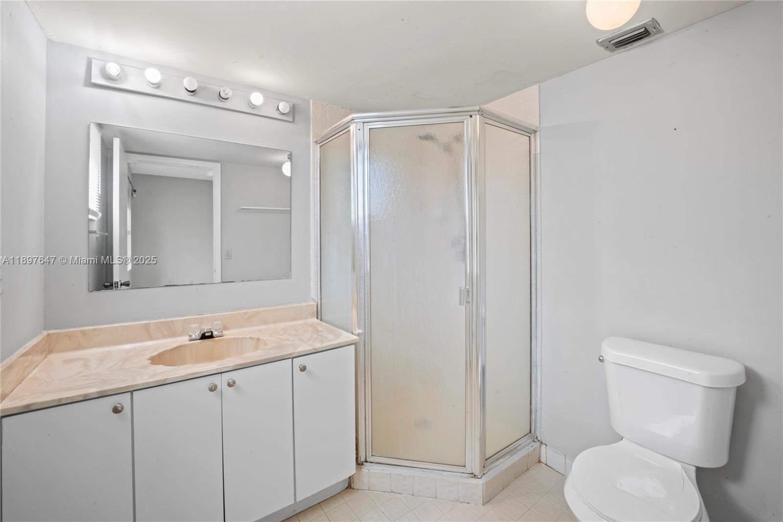 8530 Southwest 149th Avenue, Unit 906 Miami, FL 33193 - Photo 14 of 20 a bathroom with a granite countertop sink toilet and shower