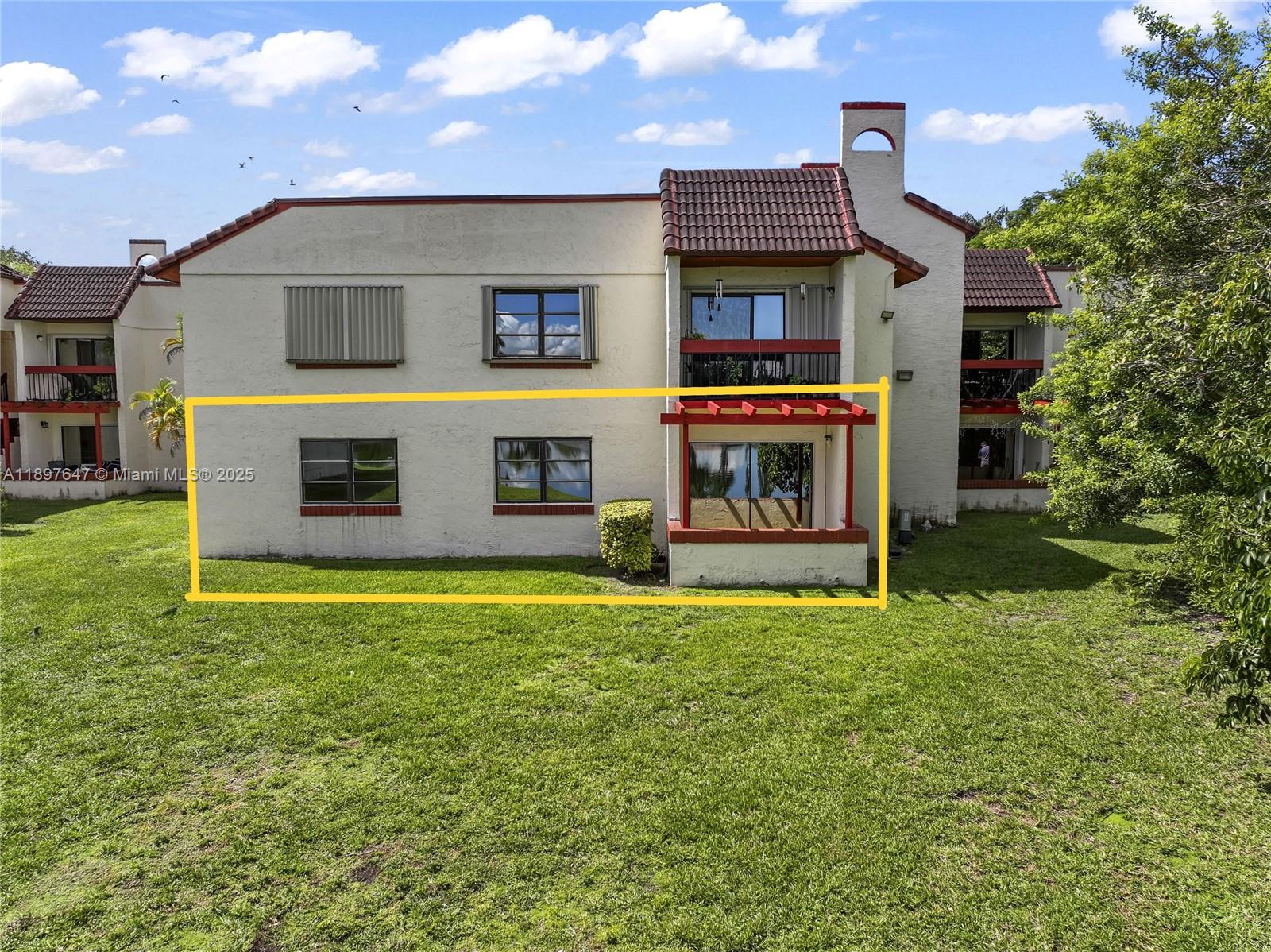 8530 Southwest 149th Avenue, Unit 906 Miami, FL 33193 - Photo 16 of 20 a house view with a garden space