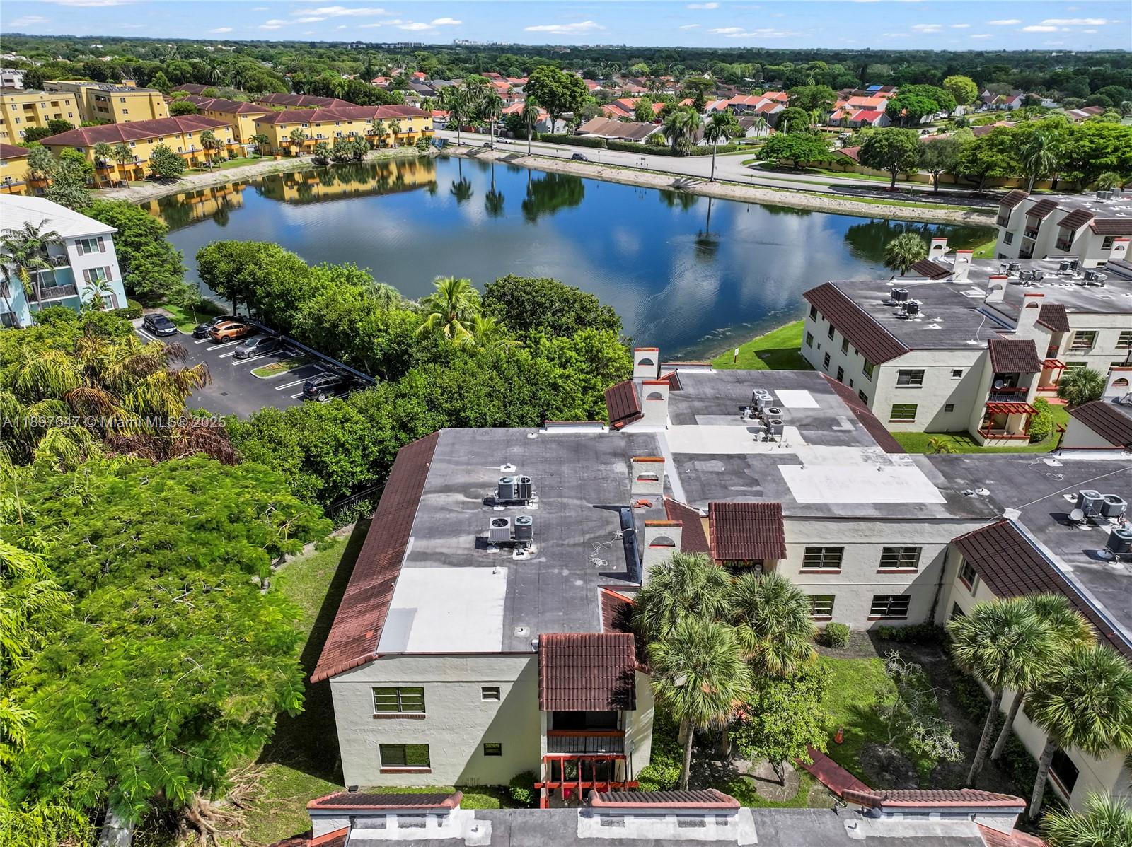 8530 Southwest 149th Avenue, Unit 906 Miami, FL 33193 - Photo 18 of 20 an aerial view of residential houses with outdoor space