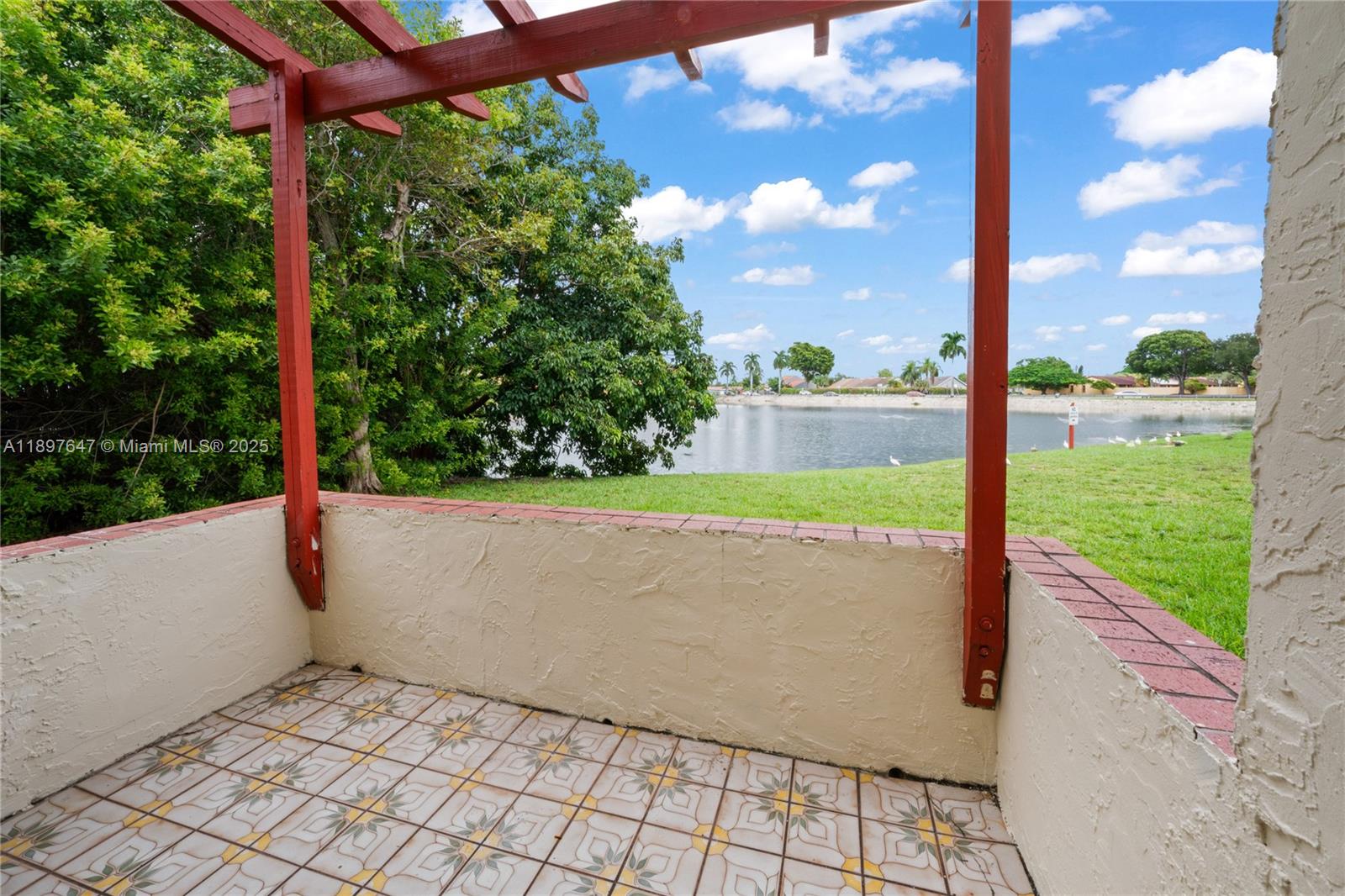 8530 Southwest 149th Avenue, Unit 906 Miami, FL 33193 - Photo 2 of 20 a view of yard with a large tree